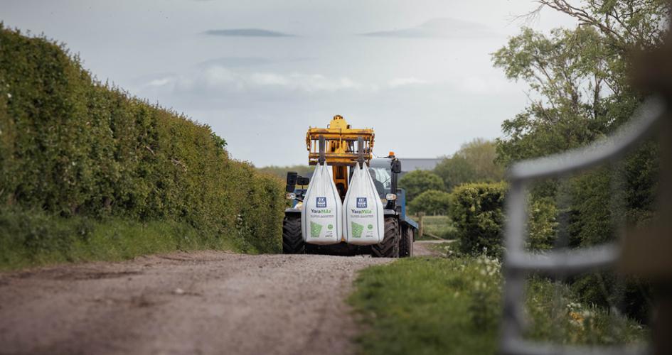 Recycled plastics fertilizer bag in field